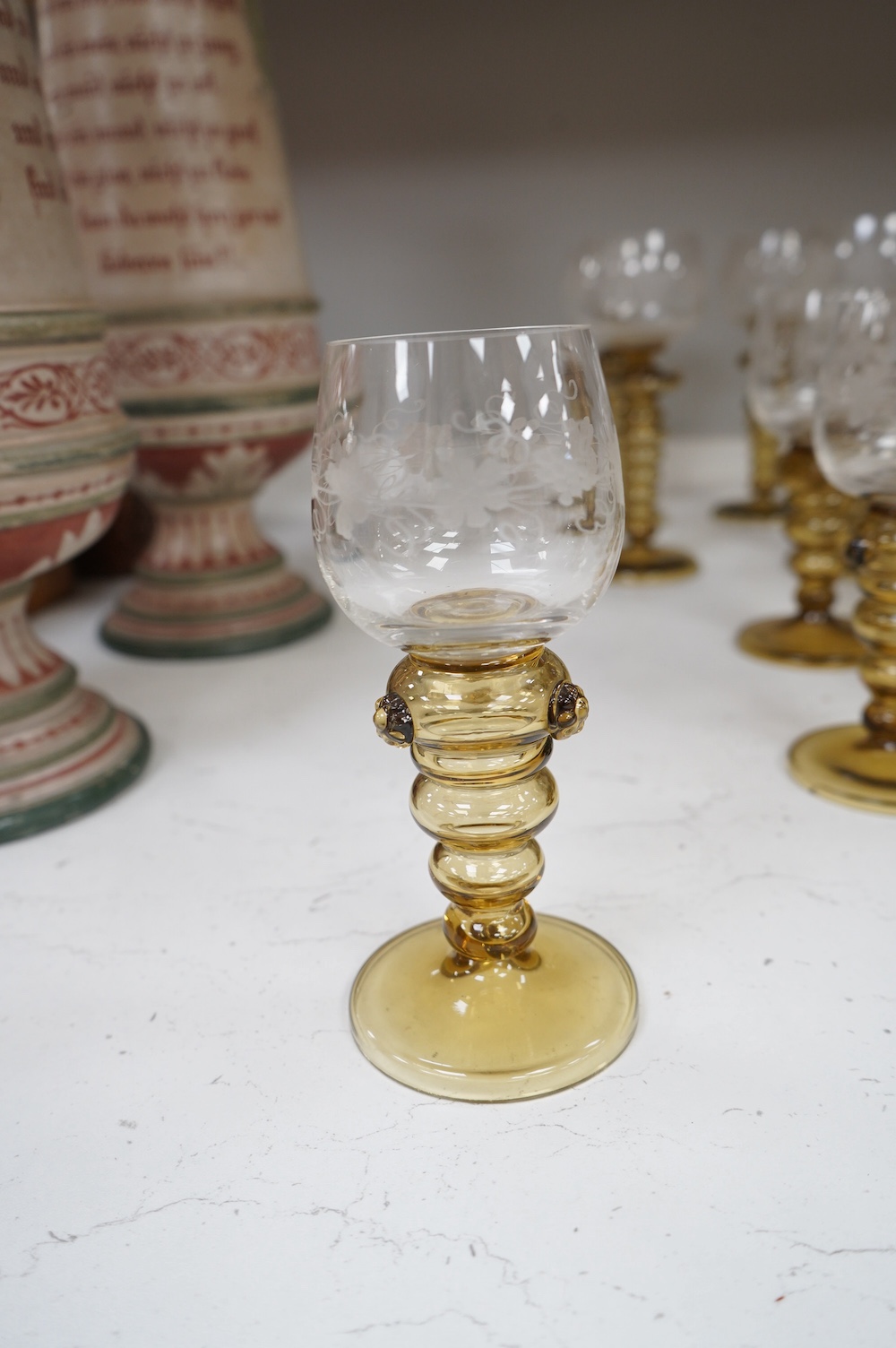 A collection of twenty three Dutch amber stemmed roemers, with etched bowls, largest each 19cm high. Condition - good